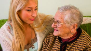 Young woman talking to elder woman